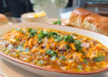 Quick and easy Kolhapuri Misal Pav made with sprouted moth beans and green peas, topped with crunchy namkeen and served with buttery pav