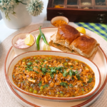Quick and easy Kolhapuri Misal Pav made with sprouted moth beans and green peas, topped with crunchy namkeen and served with buttery pav